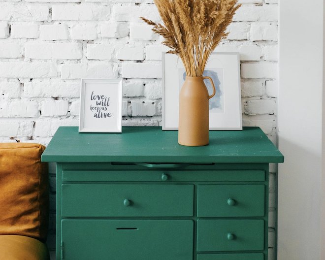 Green drawers with decorative items